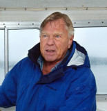 Staff Photo by Gordon Chibroski, Tuesday, April 5, 2005: Dodge Morgan guides his boat along side the dock at his island home in Harpswell during a rainy morning.